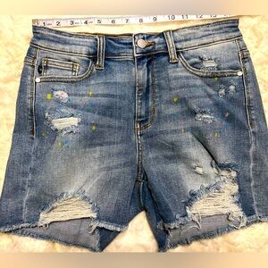 Judy Blue distressed paint splatter jean shorts.